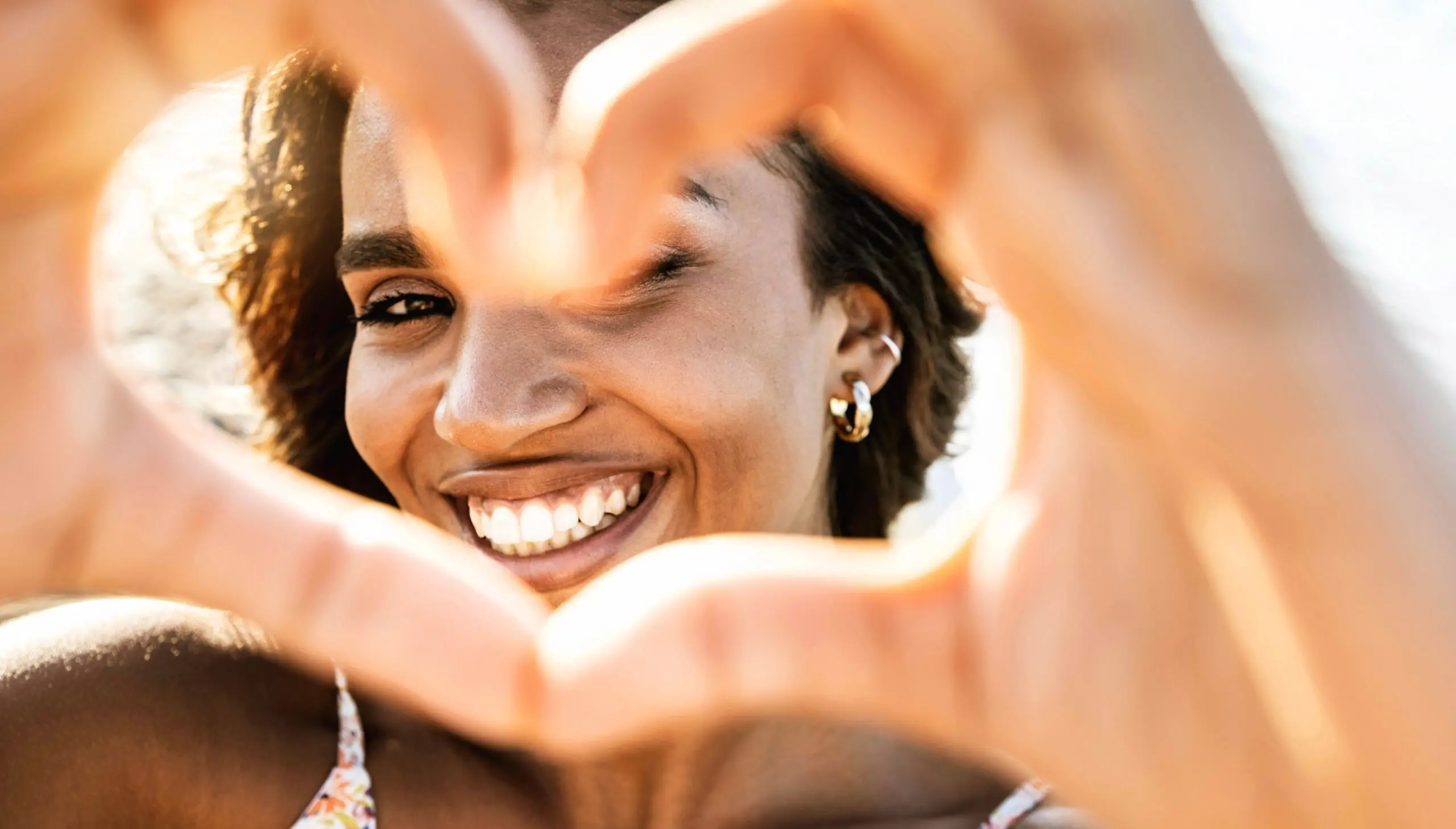 Close,Up,Image,Of,Smiling,Woman,In,Swimwear,On,The Positive Outcomes with Long Island DBT Group